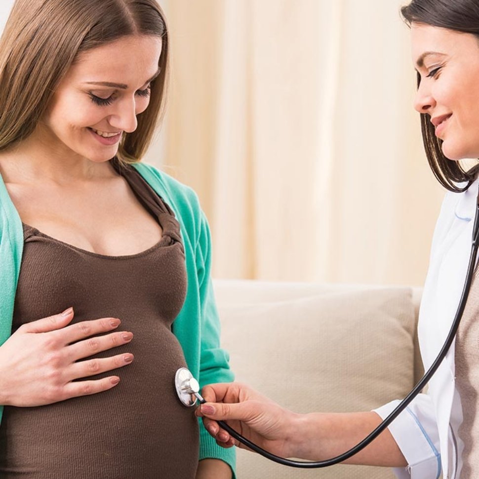 Midwife Examining Pregnant Woman 1